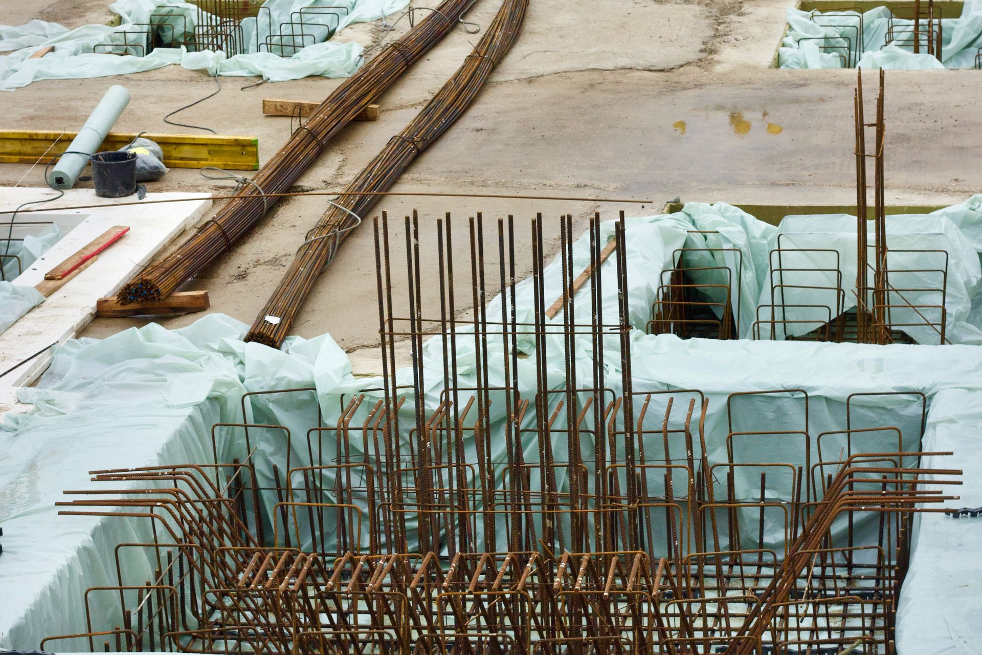 Commercial building foundation under construction with steel rebar reinforcement and edge forms