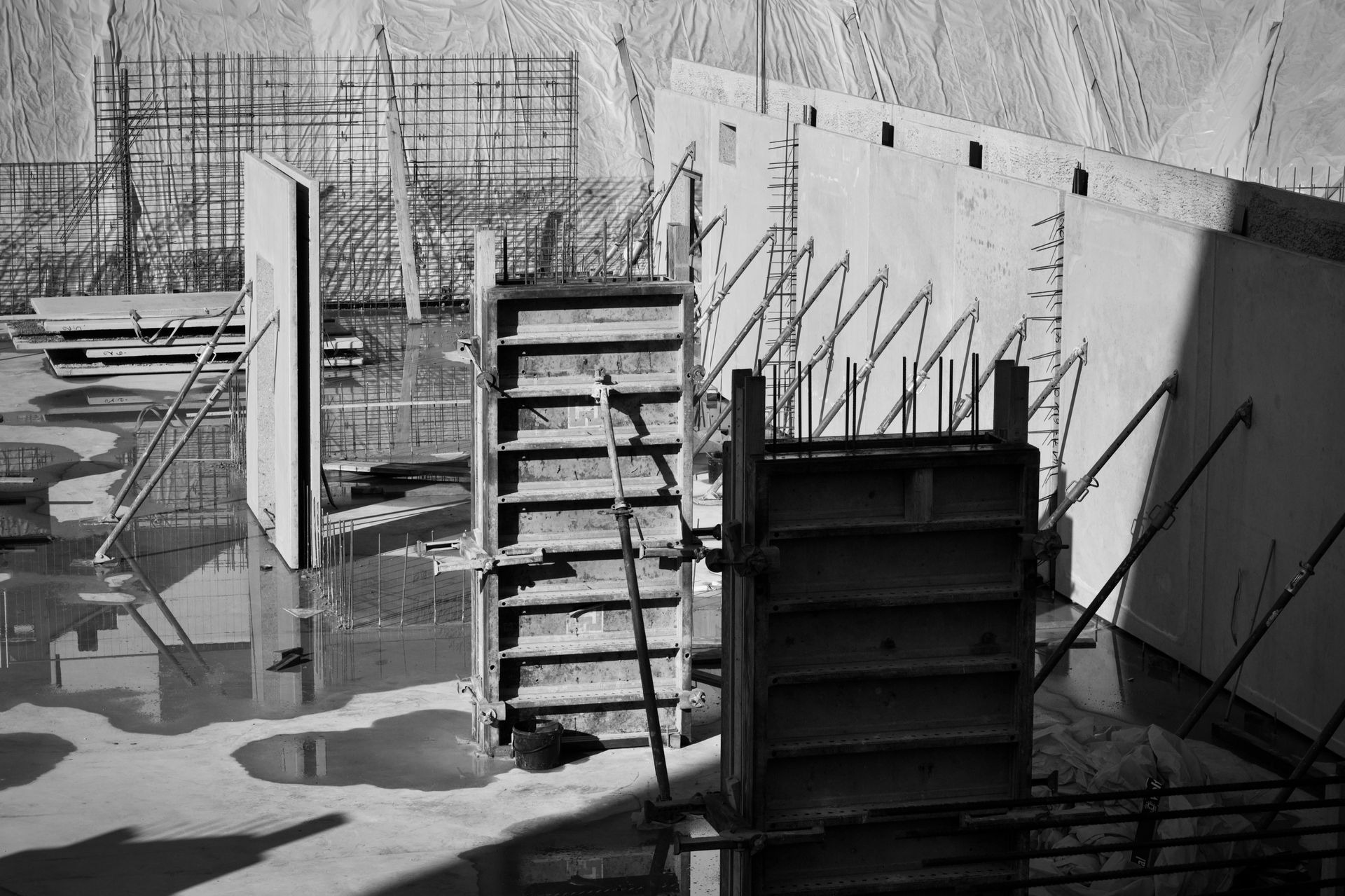 Concrete wall forms braced and ready for a pour on a construction site