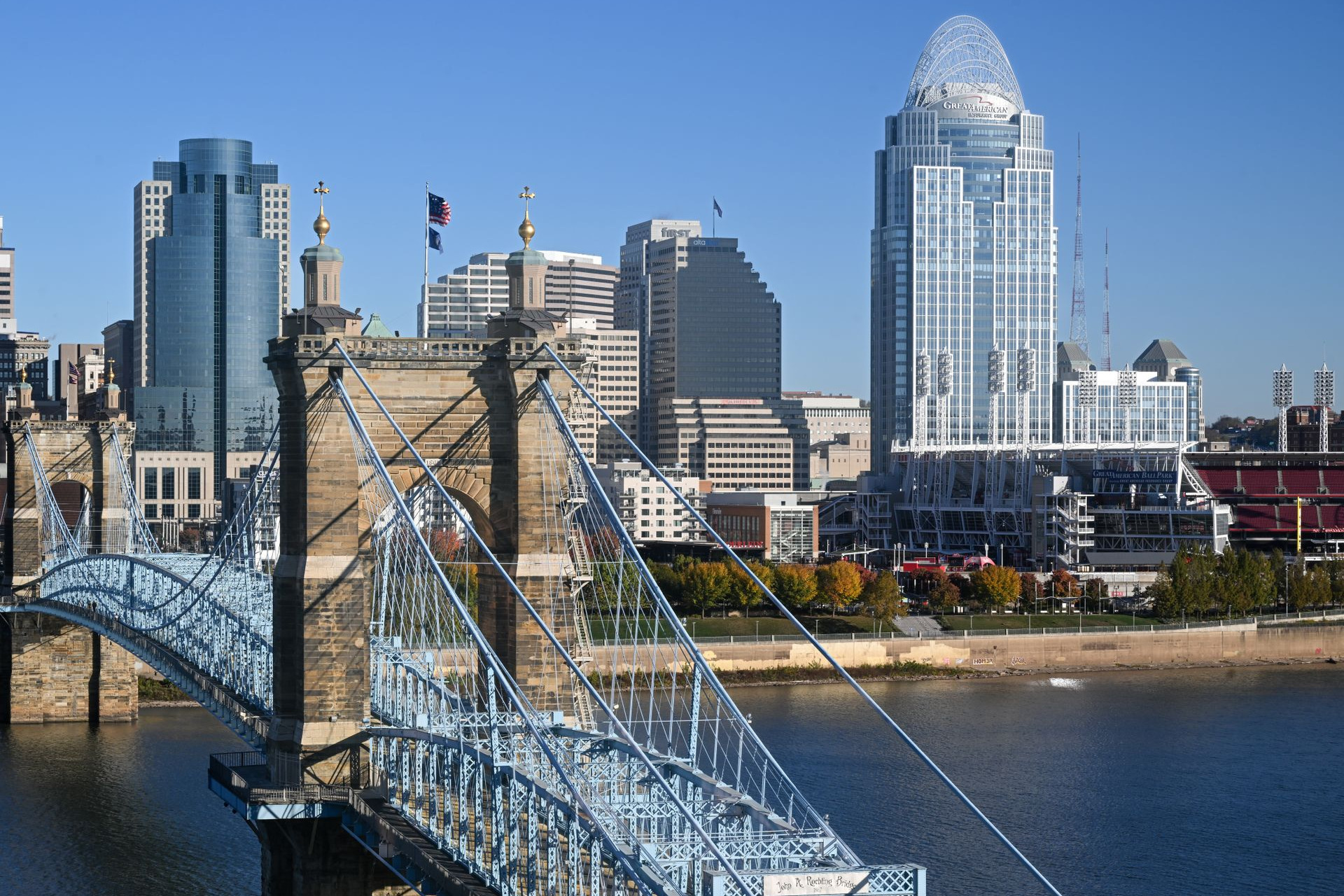 Cincinnati skyline across the Ohio River with the John A. Roebling Suspension Bridge in the foreground