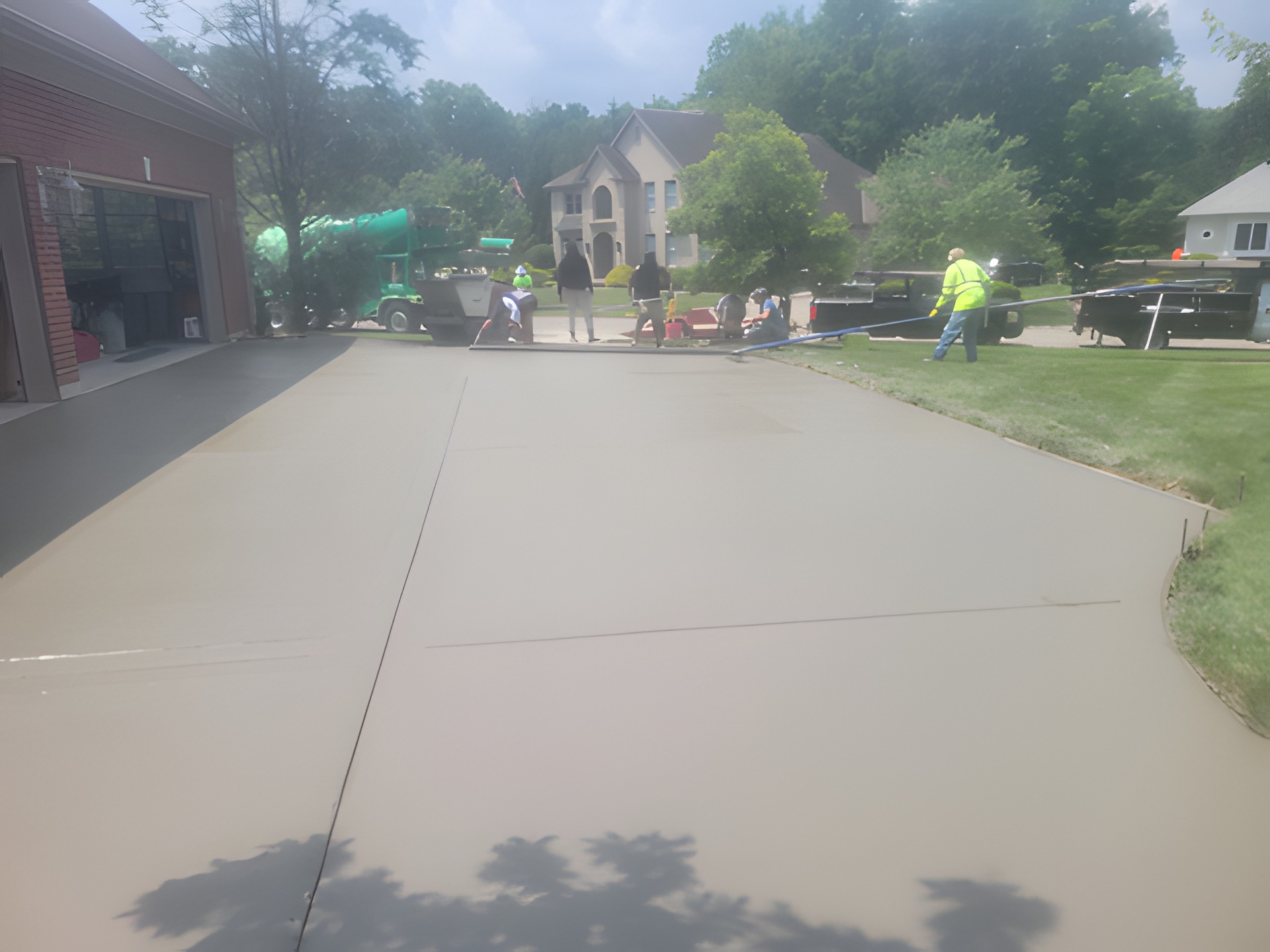 Affinity crew screeding and finishing a large residential concrete driveway in Cincinnati, Ohio